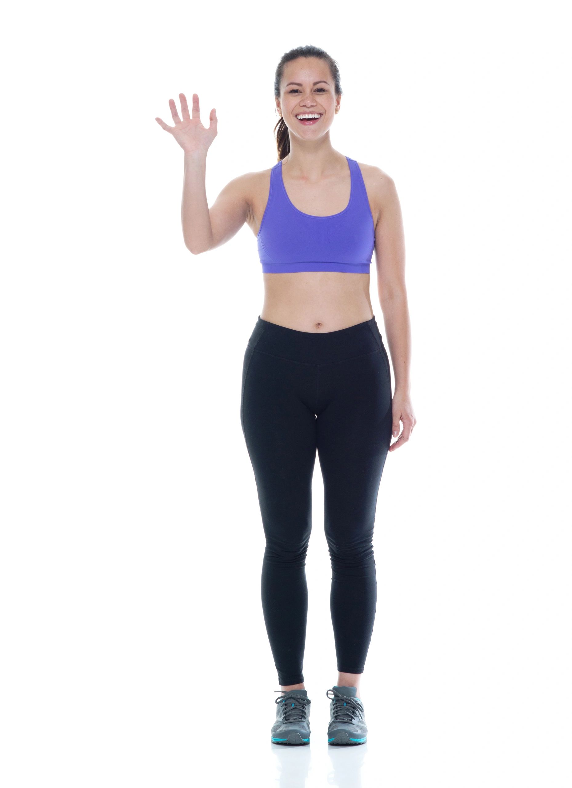 Beautiful female in sports clothing is waving